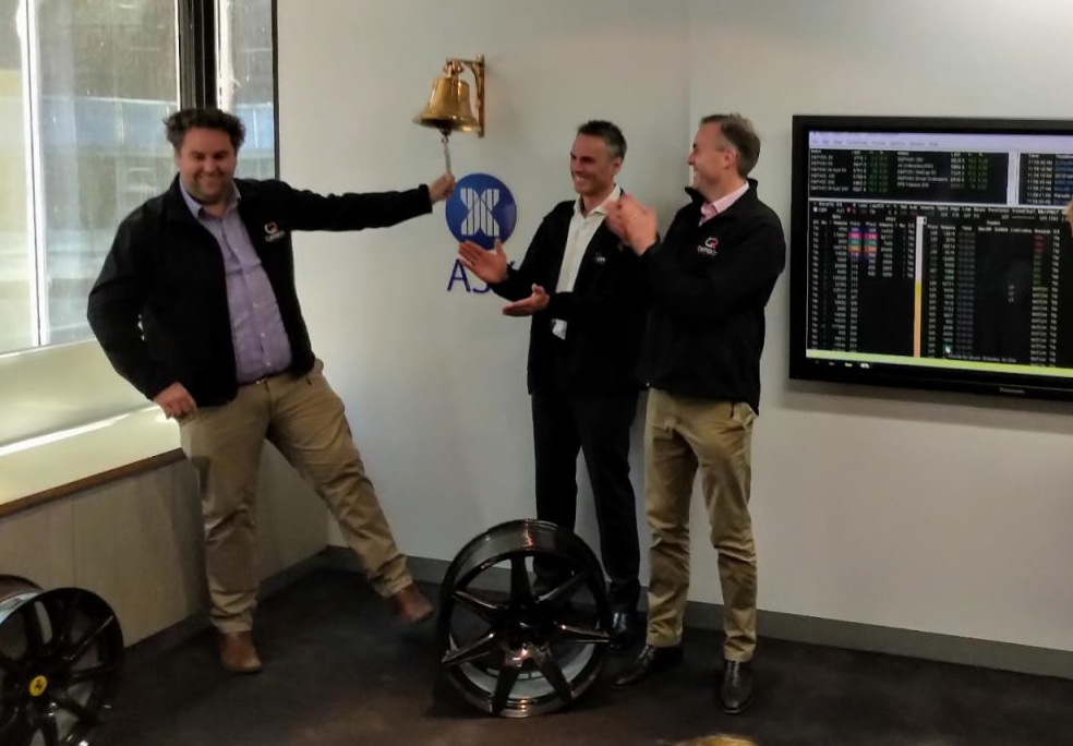 Carbon revolution representatives ringing a bell